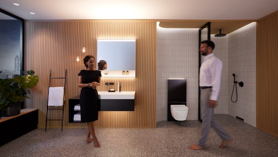 Homme et femme dans une salle de bains parfaitement éclairée avec les meubles de salle de bains et les céramiques sanitaires Geberit ONE (© Geberit) Homme et femme dans une salle de bains parfaitement éclairée avec les meubles de salle de bains et les céramiques sanitaires Geberit ONE (© Geberit)