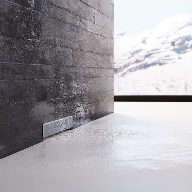 Evacuation murale Geberit dans un mur maçonné noir Evacuation murale Geberit dans un mur maçonné noir